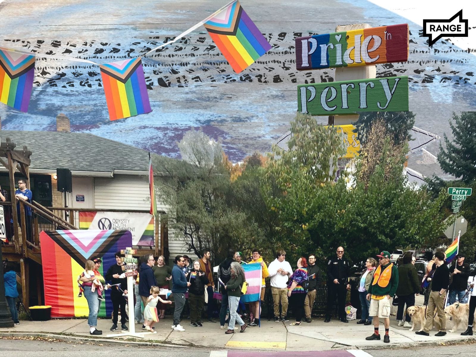 Attendees for the Pop-up Pride in Perry take a photo in front of the newly cleaned rainbow crosswalk in Spokane. 