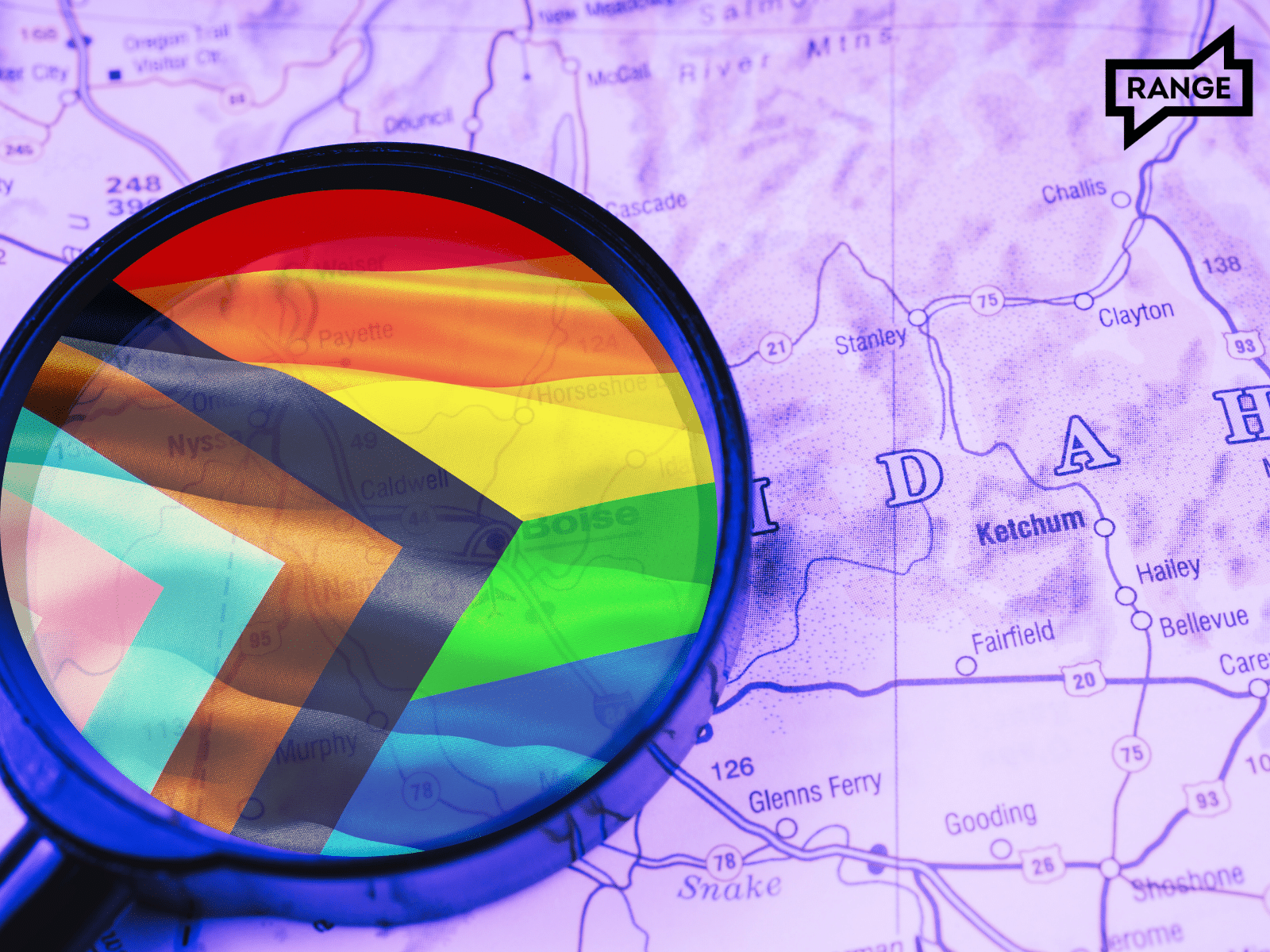 A magnifying glass over a map of Idaho, focusing on an area that shows a rainbow progress pride flag. The map is tinted purple and shows cities like Ketchum, Fairfield, and Gooding. The magnifying glass highlights the vibrant colors of the pride flag against the muted background. A 'RANGE' logo appears in the top right corner. The image suggests a focus on LGBTQ+ issues or presence in Idaho.