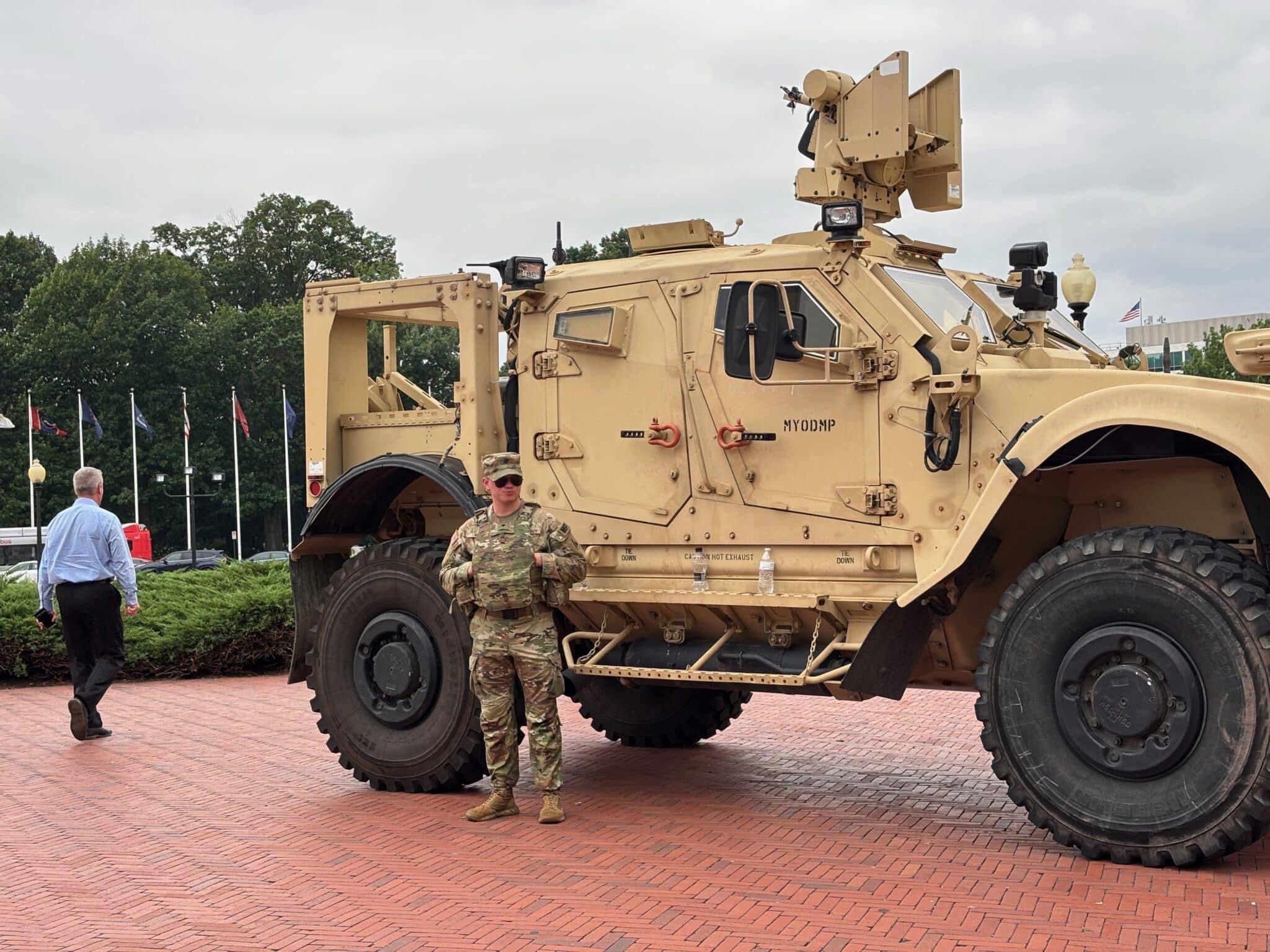 A member of the National Guard stands alongside a military vehicle parked in front of Union Station, near the U.S. Capitol in Washington, D.C., on Aug. 18, 2025.